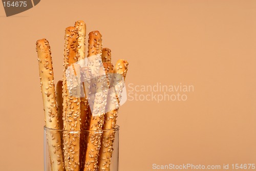 Image of Sesame breadsticks in clear glass