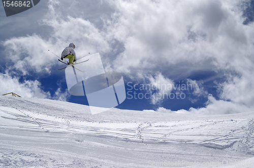 Image of Freestyle ski jumper with crossed skis
