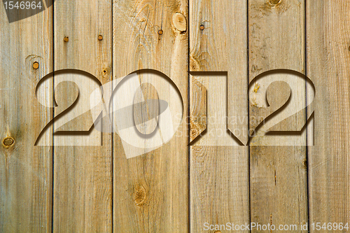 Image of wall of boards with the words 2012