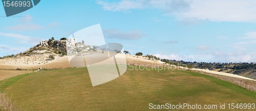 Image of Rural landscape with ruin of farmhouse on the hill