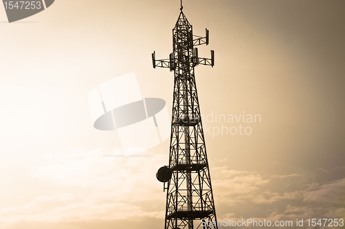 Image of High voltage post against sky at dusk