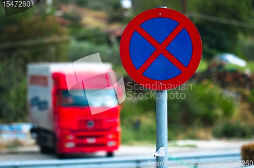 Image of Traffic sign with car in the background