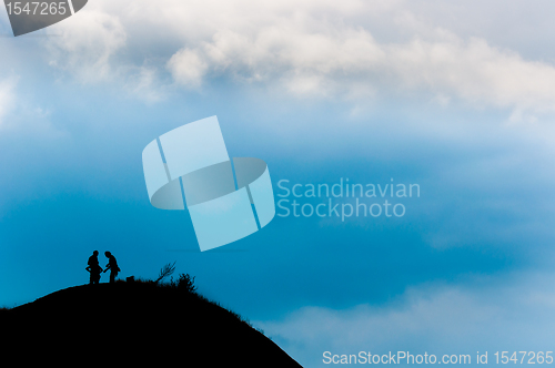 Image of A couple reached the peak of the mountain