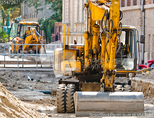 Image of Big excavators at urban construction site