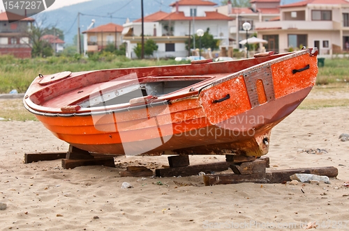 Image of Abandoned fishing boat on the shore