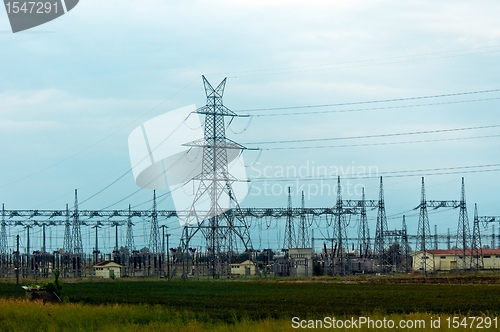 Image of Hihg voltage post against blue sky