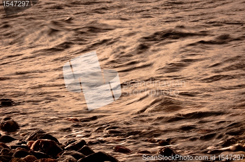 Image of Rocks on the shore of an ocean
