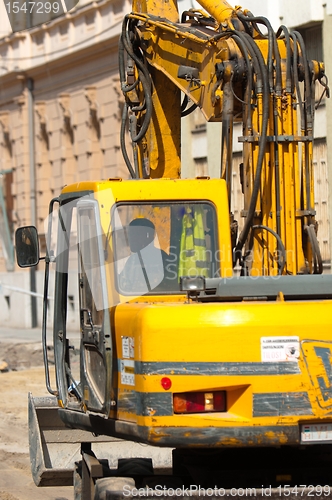 Image of Big excavator at urban construction site