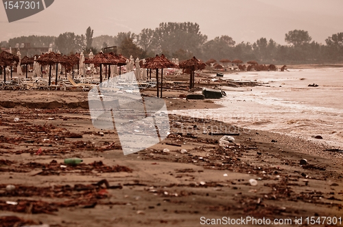 Image of A dirty polluted beach  in the rain