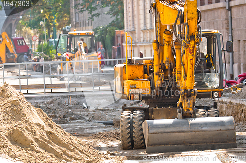 Image of Big excavators at urban construction site