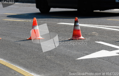 Image of Road block with white arrow showing the alternate way