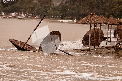 Image of A dirty polluted beach  in the rain