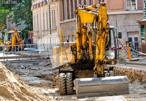 Image of Big excavators at urban construction site