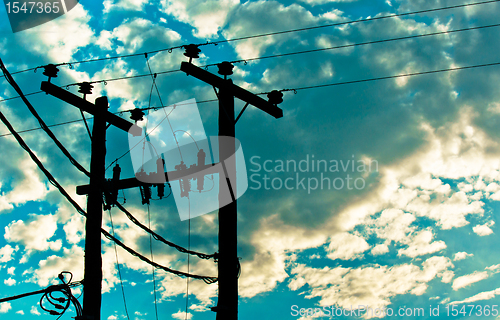 Image of Hihg voltage post against sky