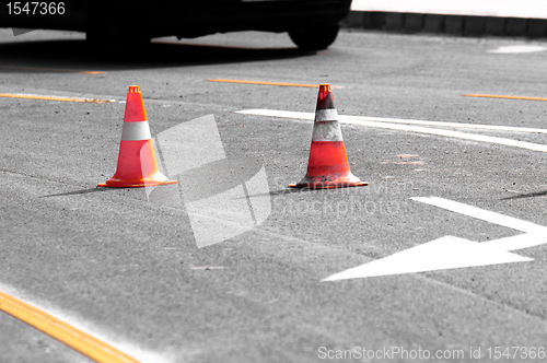 Image of Road block with white arrow showing the alternate way