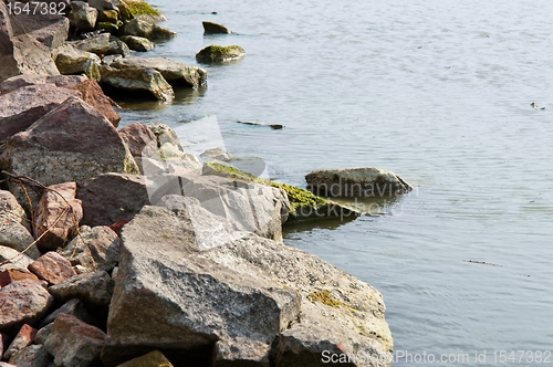 Image of Tranquil scene ath the sohres of an ocean