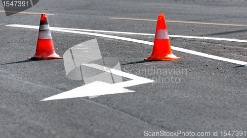 Image of Road block with white arrow showing the alternate way