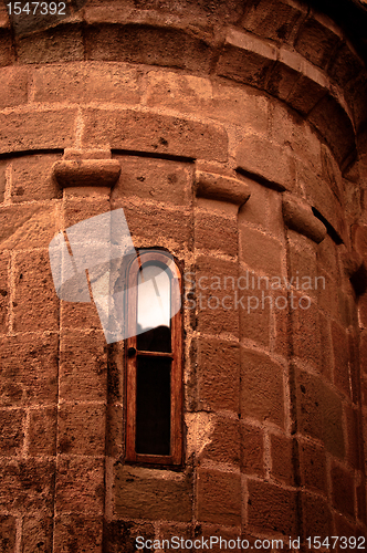 Image of Old windows on brick wall