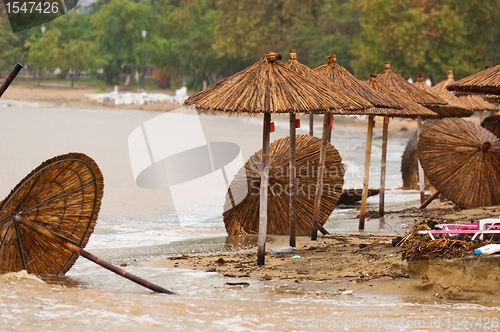Image of A dirty polluted beach  in the rain