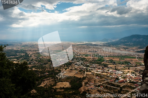 Image of Sun shining down on small town