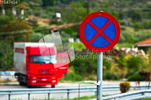 Image of Traffic sign with parked truck in the background