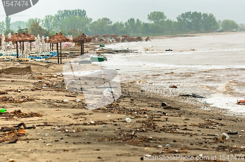 Image of A dirty polluted beach  in the rain