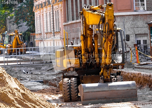 Image of Big excavators at urban construction site