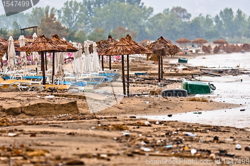 Image of A dirty polluted beach  in the rain