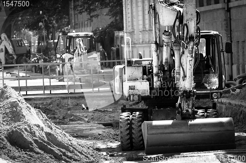 Image of Big excavators at urban construction site