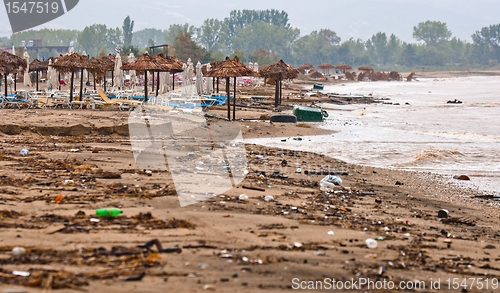 Image of A dirty polluted beach  in the rain