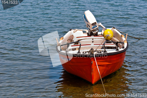 Image of Small boat on blue water 