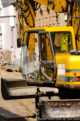 Image of Big excavator at urban construction site