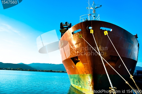 Image of Big transportation boat at the bay against blue sky