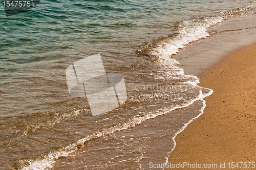 Image of Coastal line with water and sand at the ocean