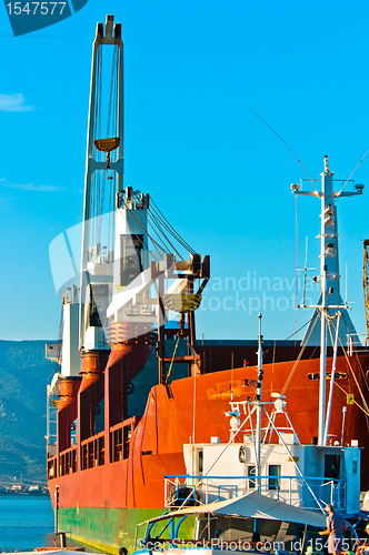 Image of Big transportation boat at the bay against blue sky