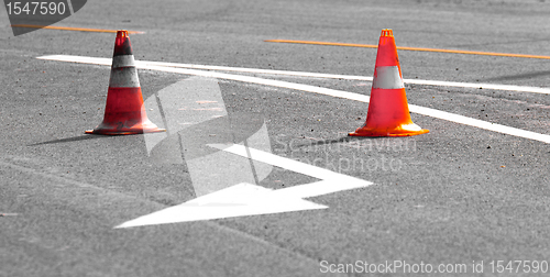 Image of Road block with white arrow showing the alternate way