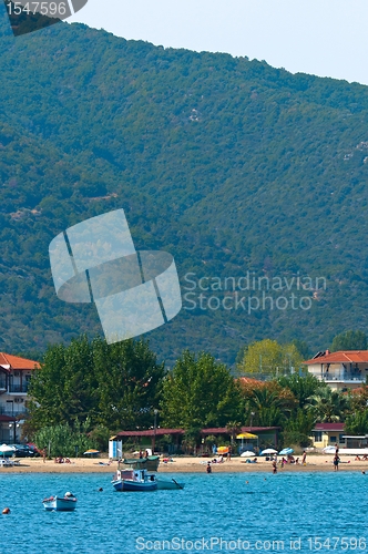 Image of Part of a sea with mountain and boat