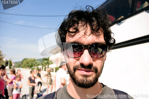 Image of Young tourist in his sunglasses traveling