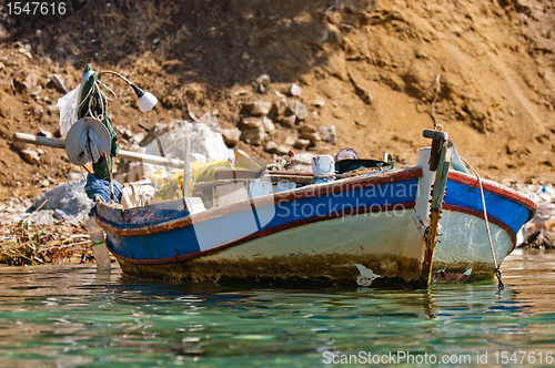 Image of Small fishing boat on the shore