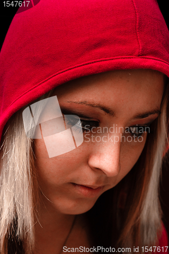 Image of Attractive young woman in red hood