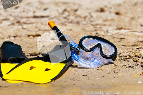 Image of Goggles and flippers on the beach