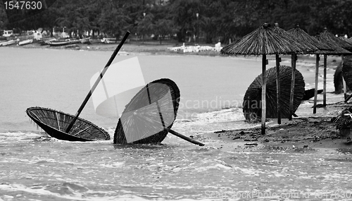 Image of A dirty polluted beach  in the rain