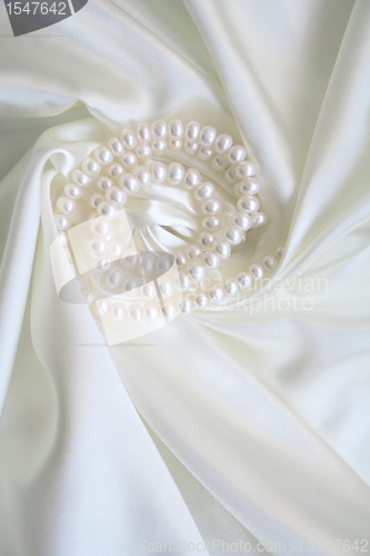 Image of Smooth elegant white silk with pearls as wedding background 