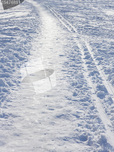 Image of Snow covered park walkway