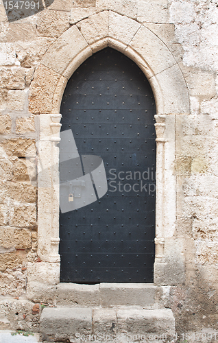 Image of Old black medieval door with sliding door bolt