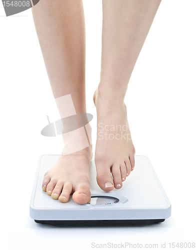 Image of Feet on bathroom scale