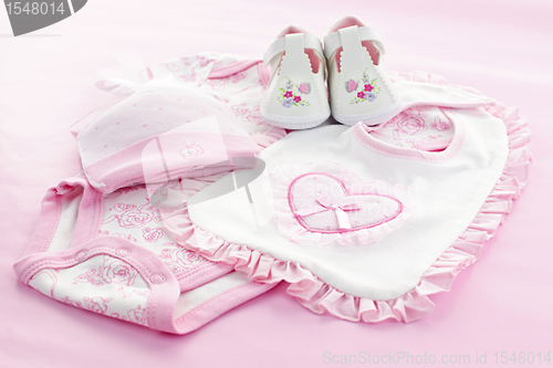 Image of Pink baby clothes for infant girl
