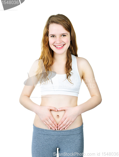 Image of Smiling girl with hands on tummy