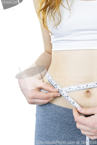 Image of Healthy girl measuring her waist