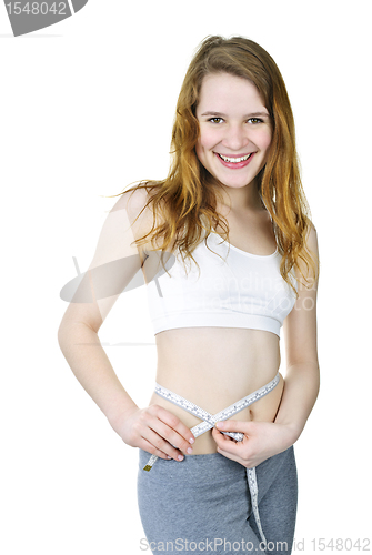 Image of Healthy girl measuring her waist